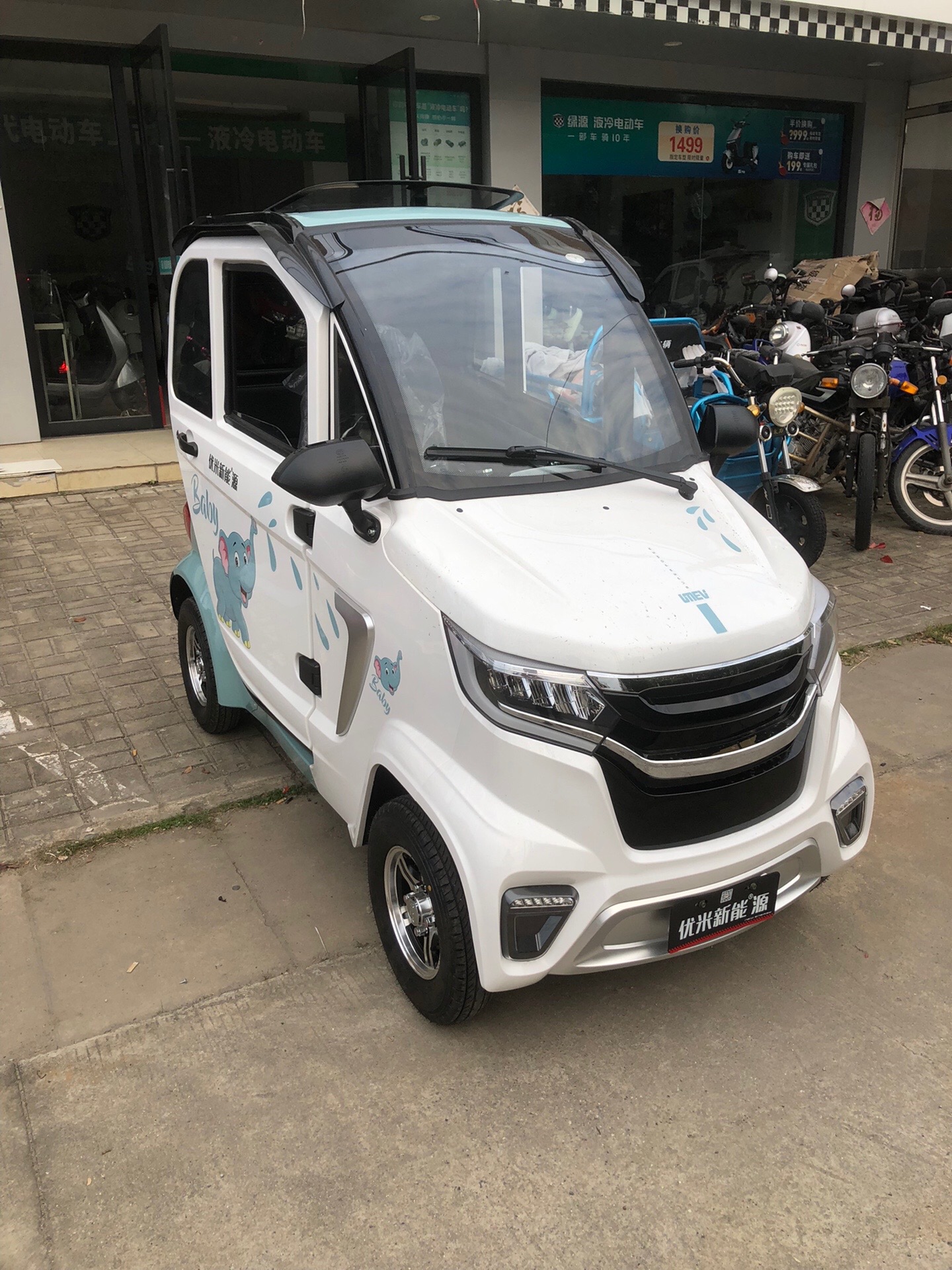 浦头绿源电动车:优米四轮车,接娃神器!