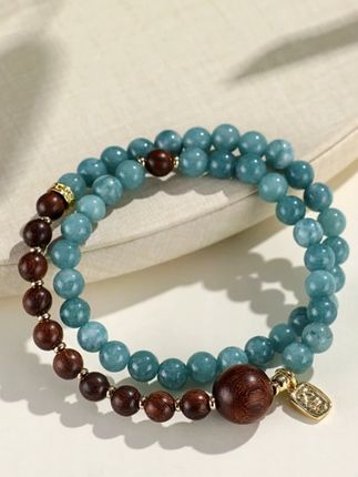#手串 #珠宝首饰 #金丝檀木手链 #新中式国风 #送朋友闺蜜 @DOU+好生意 @DOU+小助手把敦煌的色彩之美戴在手上是什么感觉?敦煌绮梦·青岚玉髓手链,它的设计灵感来源于敦煌壁画的经典形象。青岚玉髓是敦煌壁画中常见的色彩搭配,象征着祥瑞与高贵。手链采用手工镶嵌、抛光打磨等工艺,每个细节都精致无比,仿佛一幅微型的敦煌壁画。